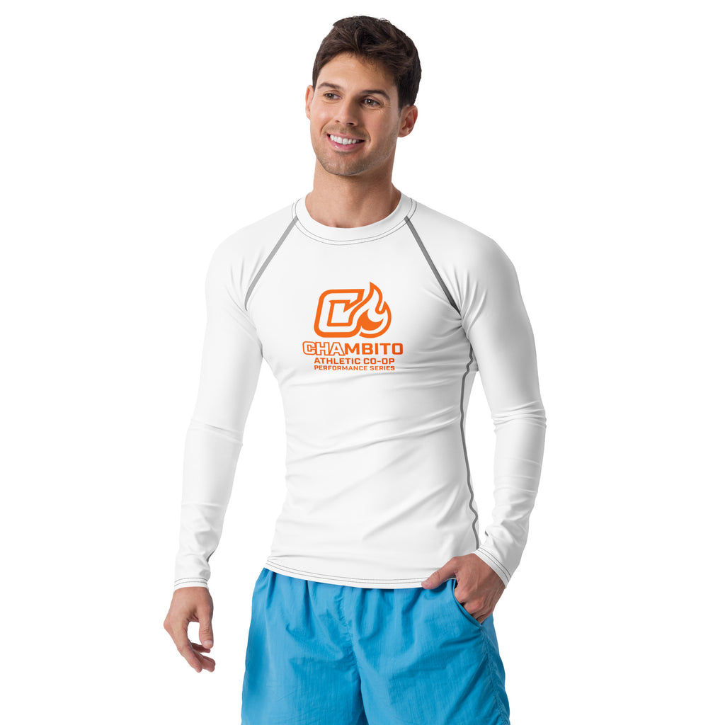 Man wearing a white long-sleeve shirt with a logo and blue shorts on a white background