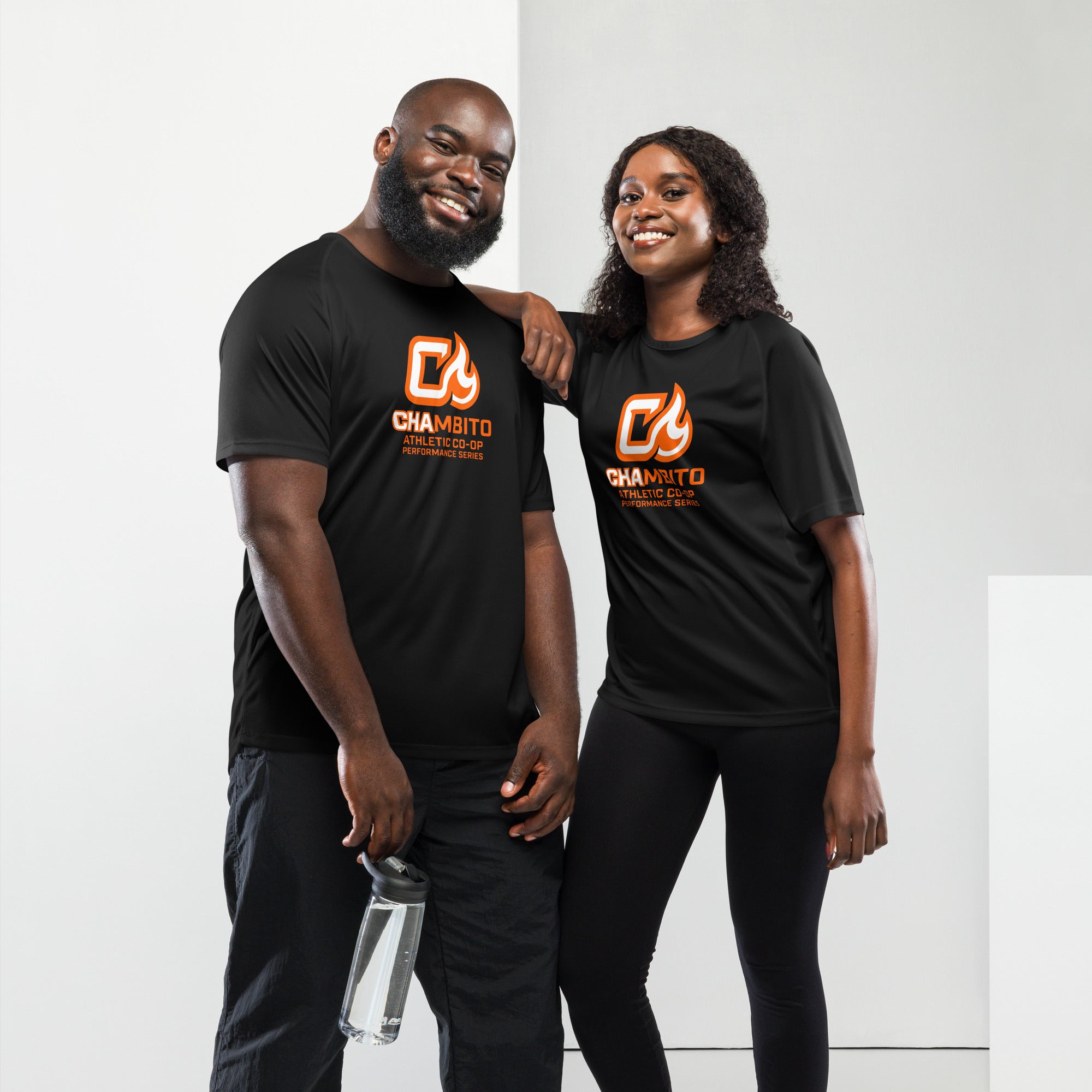 Two people wearing black t-shirts with a logo on a white background