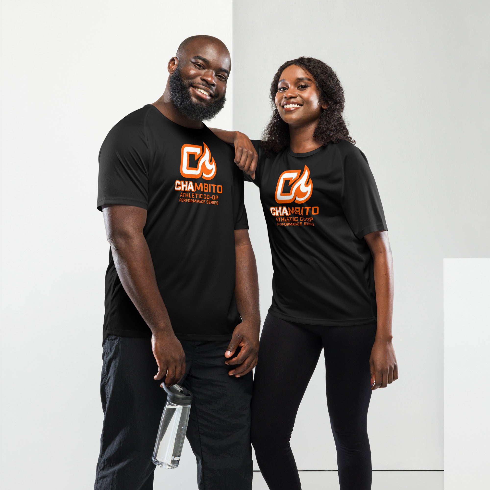 Two people wearing black t-shirts with a logo on a white background