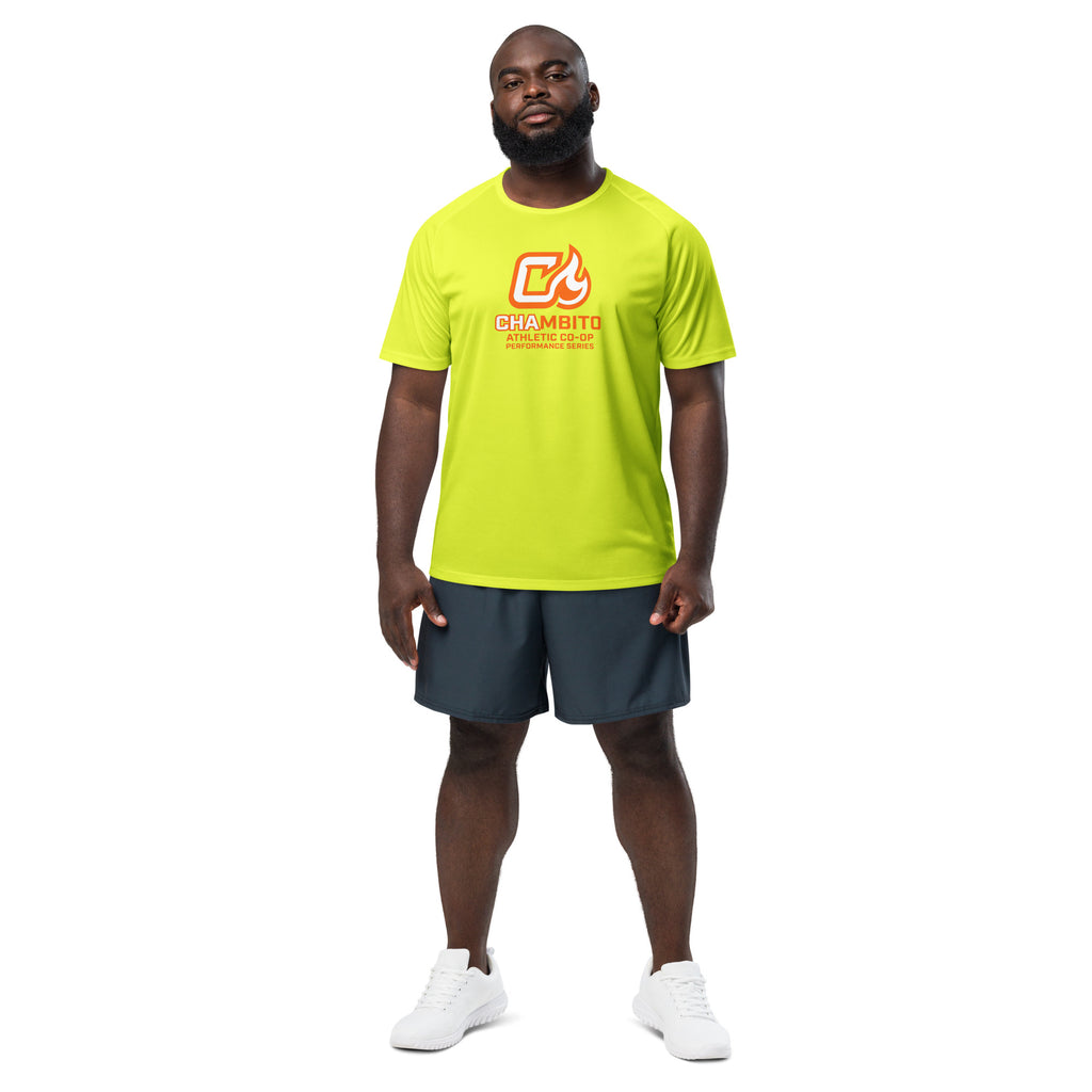 Man wearing a bright green t-shirt with a logo and dark shorts on a white background