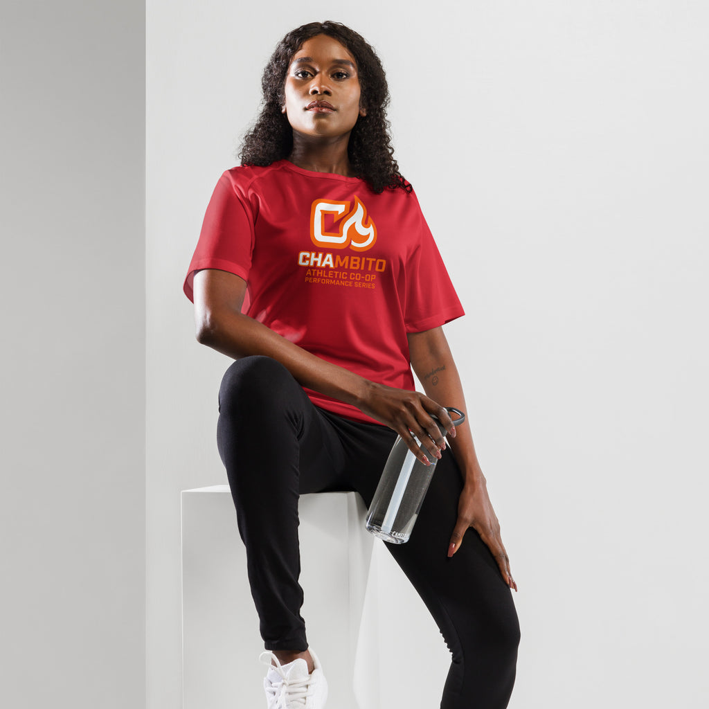 Person wearing a red 'Chambito' t-shirt holding a clear water bottle against a white background