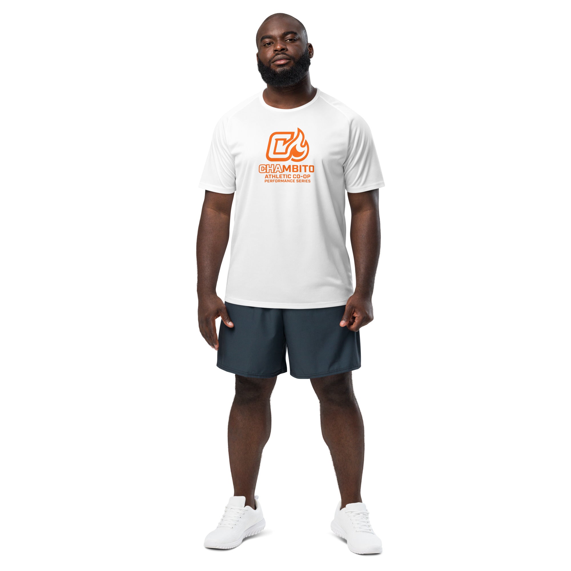 Man wearing a white t-shirt with a logo and dark shorts on a white background